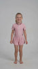 Traje de baño niña con falda protección UV rosado
